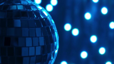 Disco Light. Rotating disc light. Disco ball.multicolored neon lights. Color footage 4K. Rotating mirror disco ball in restaurant party