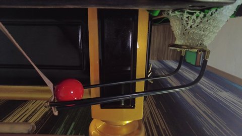 The Red ball falling in hole to the snooker pocket rail , successfully shot , indoor sport concept , 4K 59.94 fps footage