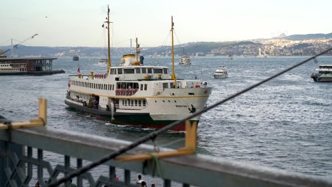 Istanbul, Turkey - August 2021: Istanbul City passenger ferry ship arriving at Eminonu pier at Bosphorus