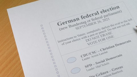 KHARKIV, UKRAINE - SEPTEMBER 1, 2021: Concept of German federal election. Ballot paper and pen with vote tick box for check. New Bundestag or federal parliament. Right to vote and freedom in Germany