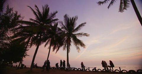 Local people enjoying the sunset that overlooks the South China Sea in the quant town of Miri.