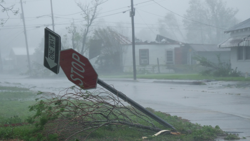 Hurricane Ida Blows Over Stop Sign With A Damaged Home In the Background In Houma, Louisiana USA During Category 4 Storm | Shutterstock HD Video #1078502654