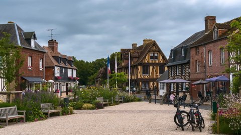 Beuvron en Auge, France - August 3, 2021: Beuvron-en-Auge, one of the most beautiful villages in France, is a commune in the Calvados department and Normandy region. Time lapse.