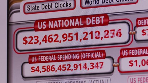 Minsk, Belarus - Mar 13, 2020 (Ungraded): A computer monitor shows an online counter of the rapidly growing US national debt. Ungraded H.264 from camera without re-encoding.