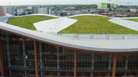 Green roof of sustainable urban city building in Nashville, TN, USA. Environmentally friendly modern design. Aerial.