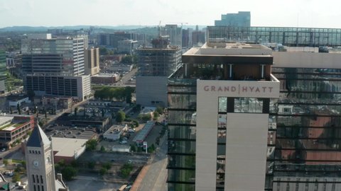 Nashville , TN , United States - 08 09 2021: Grand Hyatt. Aerial orbit in downtown urban Nashville TN, USA. Union Station in distance.