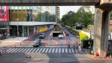 Bangkok, Thailand - April 6, 2020: Empty road scene in Bangkok. With the latest wave of COVID-19 continuing to have a serious impact on Thailand, many businesses have been looking for ways to survive.