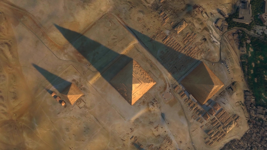 Aerial top down view of Giza Pyramid Complex also called Necropolis is site on the Plateau in Greater Cairo Egypt that includes the Pyramids of Khafre, Khufu and Menkaure 4k high resolution animation | Shutterstock HD Video #1078519874