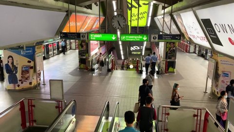 Bangkok, Thailand - April 6, 2020:  Passengers waiting for the BTS sky train in SIAM station and Asok station in the evening. There are fewer passenger in the BTS and MRT due to covid 19.