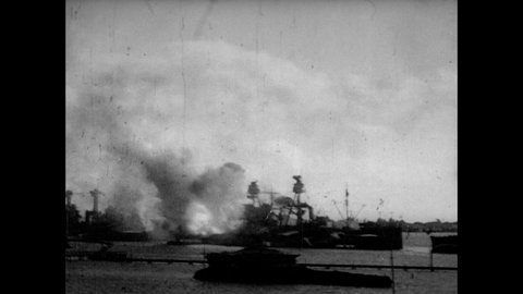 1950s: Navy ship at Pearl Harbor explodes in attack from Japan. Buildings explode. Looking off wing of Japanese fighter plane as bombs drop on Pearl Harbor. People in street, buildings on fire.