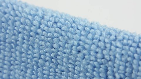 close-up macro view on blue microfiber dusting cloth, well-absorbing water synthetic fabric, texture of textile