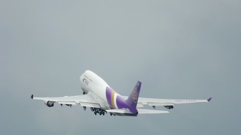 PHUKET, THAILAND - NOVEMBER 26, 2018: Boeing 747, HS-TGA of Thai Airways takes off from Phuket International Airport, Thailand (HKT). Retract landing gear on takeoff