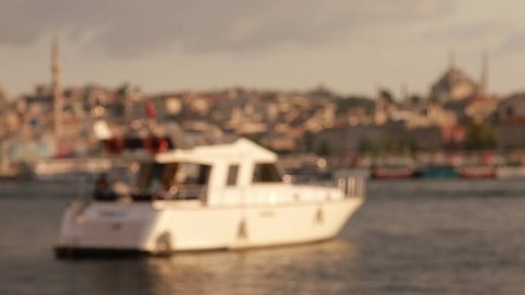 Blur texture background for design. Out of focus view of the sea and ships sailing on the water. View of the Sea of ​​Marmara and the Bosphorus in Istanbul city on a sunny summer day.