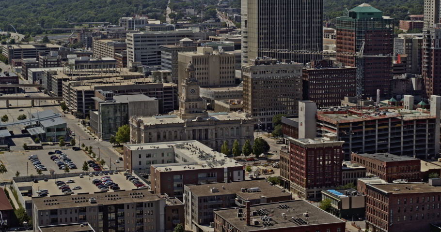 Des Moines Iowa aerial low level fly past of the downtown area including big old and modern buildings - August 2020