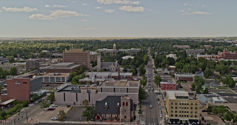 Cheyenne Wyoming Aerial v2 cinematic dolly in drone flying through renaissance revival style state capitol building surrounded by greenery - Shot with Inspire 2, X7 camera - August 2020