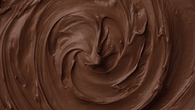 Chocolate. Melted chocolate top view rotating. Confectionery concept. 4K UHD video 