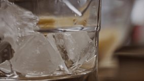 A glass of ice and water. 4k macro video