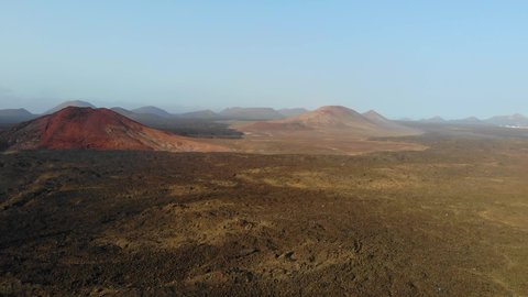 Lanzarote, Canary islands, spain. vulcanic valley with mountains in the background on a sunset light