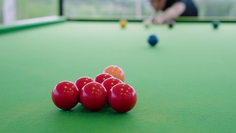 Close up of Snooker shooting on snooker table in slow motion