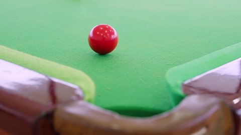 Closeup cue shooting snooker ball on the snooker table in slow motion