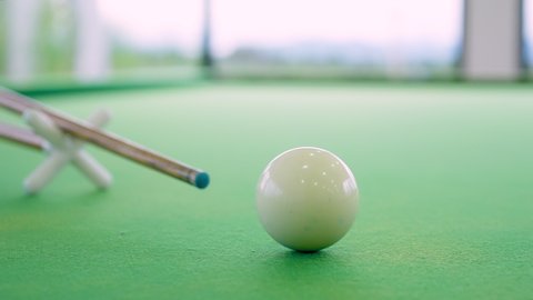 Closeup cue shooting snooker ball on the snooker table in slow motion
