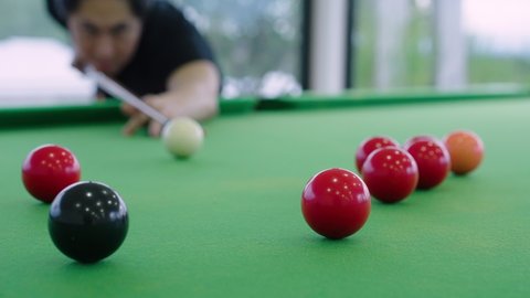 Close up of Snooker shooting on snooker table in slow motion