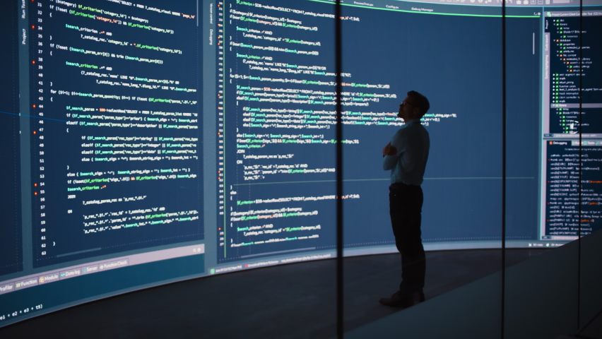 High-Tech Startup Concept: Innovative Male Software Engineer Standing, Doing Big Data Analysis on Wall Screen Showing Porgramming Code. Developing Futuristic e-Commerce App with Machine Learning. Full Royalty-Free Stock Footage #1078602062