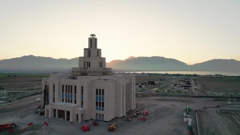 Aerial Shot of LDS Mormon Saratoga Springs Temple With Utah Lake and Mountains in Backdrop