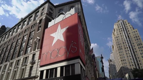 NEW YORK, USA - MAY, 18, 2021: Macy's shopping center store building outdoors. Red logo and star on facade. Summer sunny day at Manhattan in NYC.