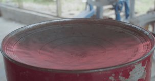 Oil drum after the bottom has been sunk in ready for steel pan building - Powered by Shutterstock - Get 15% off with code: PIKWIZARD15