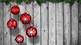 Animation of christmas baubbles over wooden background. christmas, tradition and celebration concept digitally generated video.