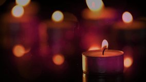 Animation of tea light candles with flickering spots of light. remembrance, celebration and tradition concept digitally generated video.
