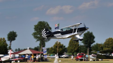 Ferrara Italy JUNE, 27, 2021 Extreme aerobatic retro biplane takes off and pull up. Christen Pitts S-2B Special