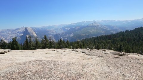Yosemite summit panorama of half dome, view after hiking in Yosemite National Park at Sentinel Dome. Aerial view of popular El Capitan from Sentinel Dome. Summer travel in United States, California.