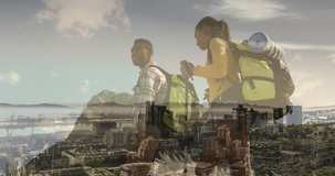 Composite of diverse couple hiking on mountain, and modern cityscape. health, fitness and wellbeing concept digitally generated video.