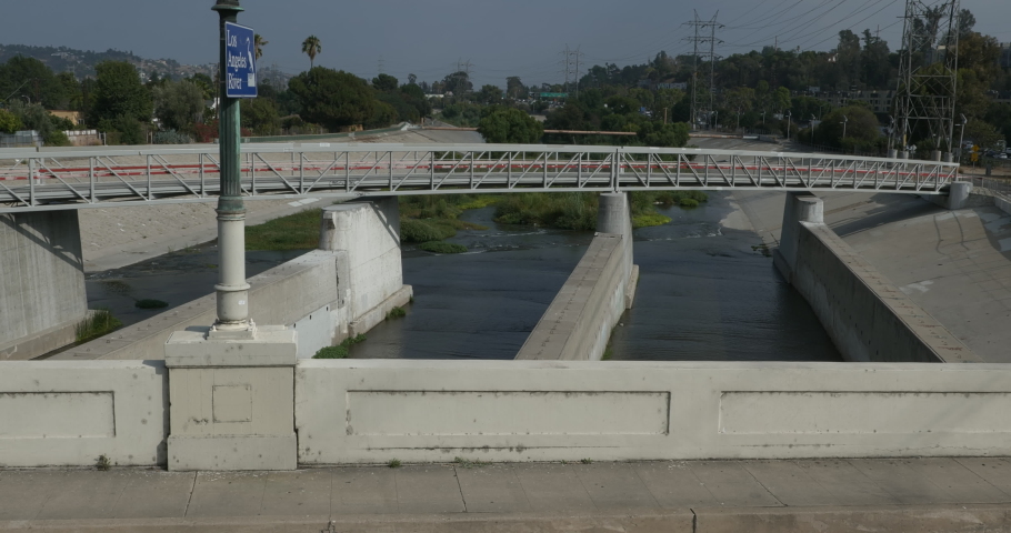 Concrete channels in the LA river under a bridge
