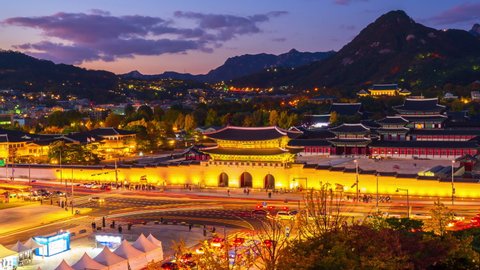 Zoom in,Autumn at Gyeongbukgung palace at night in seoul city south,korea.Time lapse 4k