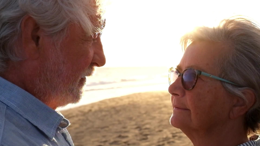 Portrait of couple of two happy seniors and mature and old people at the beach together. Pensioner and retired man consoling sad depressed wife crying.
 | Shutterstock HD Video #1078674989