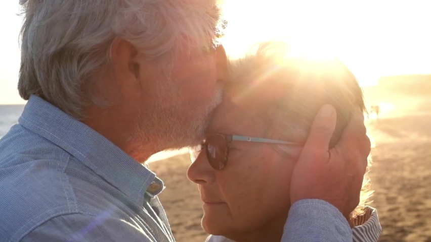 Portrait of couple of two happy seniors and mature and old people at the beach together. Pensioner and retired man consoling sad depressed wife crying.
 Royalty-Free Stock Footage #1078674989