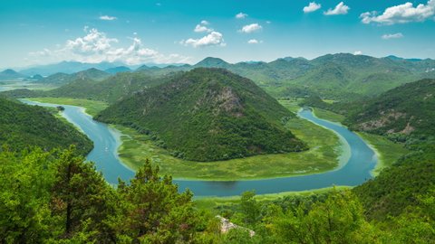 Canyon of Rijeka Crnojevica river near the Skadar lake coast. One of the most famous views of Montenegro. River makes a turn between the mountains and flows backward. Timelapse 4K