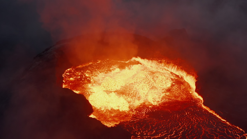 Close-up shot of magmatic material splashing out of crater. Molten lava at night. Fagradalsfjall volcano. Iceland, 2021 Royalty-Free Stock Footage #1078677707