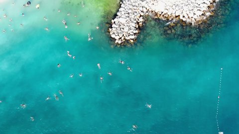 Drone view of the Croatian city of Split in the resort region of Dalmatia. Shot from a drone of a beach in Split. Croatia beach. People sunbathe on the beach view from a drone. Split architecture