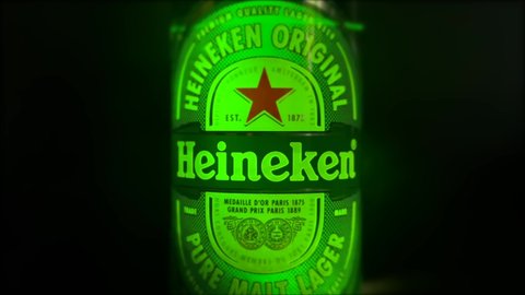 Moscow, Russia - 09.05.2021: Soft focus of label of Heineken Lager Beer. Static video of label on Bottle of Heineken Lager Beer on black background. Closeup label of Heineken Beer.