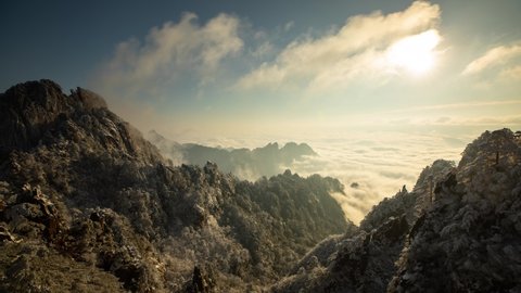 Sunrise time lapse looking out over a sea of fog at the Yellow Mountains (Huangshan) in China