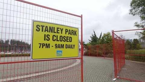 Vancouver, Canada - September 5,2021: View of sign Stanley Park is Closed from 7pm to 9am daily following attacks by coyotes in Stanley Park