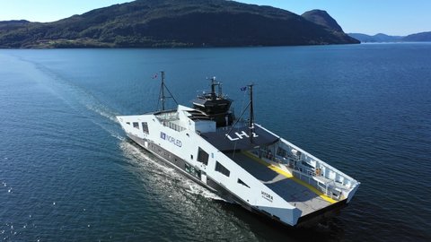 Hjelmeland , Rogaland , Norway - 08 26 2021: Worlds first ferry running on liquid Hydrogen and electricity - Norled ferry Hydra - Norway aerial showing ferry crossing between Skipavik and Nesvik