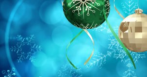 Animation of snow falling over christmas bauble decorations on blue background. christmas, winter, tradition and celebration concept digitally generated video.