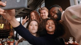 Slow motion of friends in wine bar taking selfie - Powered by Shutterstock - Get 15% off with code: PIKWIZARD15