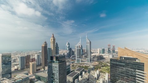 Panorama of futuristic skyscrapers in financial district business center in Dubai on Sheikh Zayed road timelapse