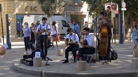 Aix-en-Provence, France - August 2021 : Street musicians playing jazz on the Cours Mirabeau in Aix en Provence a day of summer